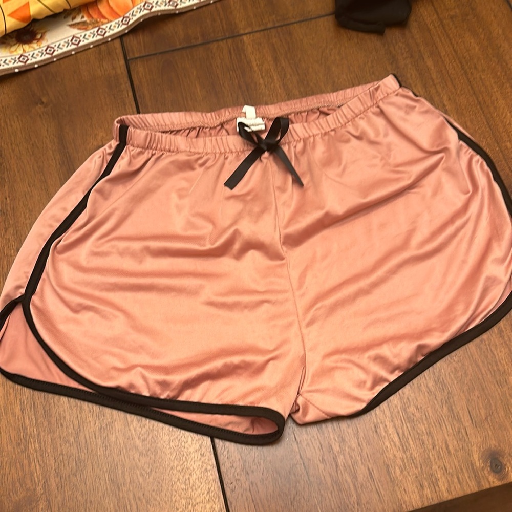 pink shorts with black ribbon